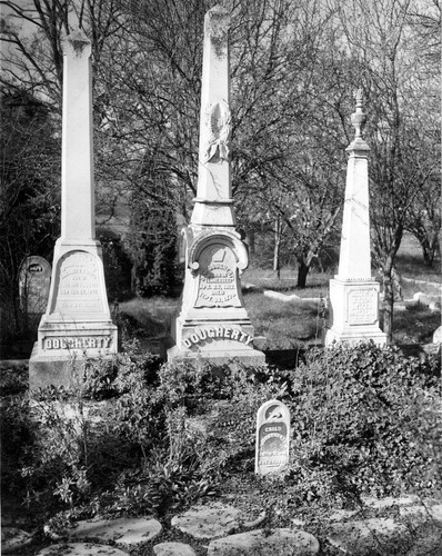 Elizabeth Dougherty (d. 1887), J.W. Dougherty (1813-1879), Ada M. Dougherty (1845-1866) and their faithful dog's, Carlo, headstones, (c. 1953), photograph