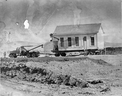 Moving wing of Old Murray School to cemetery location (1975), photograph