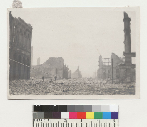 [Rubble-filled street and ruins, unidentified location.]