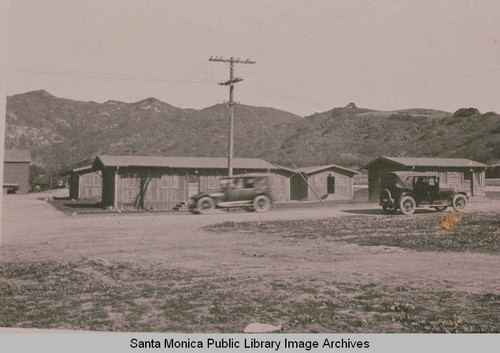 Lumber yard in Construction Center at the intersection of Temescal Road and Sunset Blvd. (then, Marquez Ave.) looking west to the Santa Monica Mountains