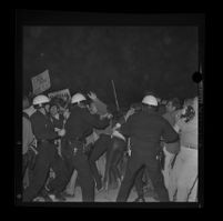 Police and protesters clash on Avenue of the Stars during a President Johnson-attended fund-raiser, 1967