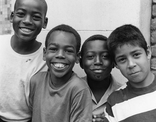 Four boys smiling