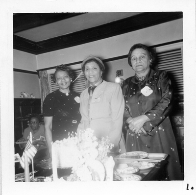 Chlora Hayes Sledge (center) and two unidentified women standing next to banquet table