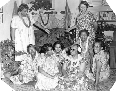 Members of the Royal 10 Social Club attending Hawaiian-themed luau party