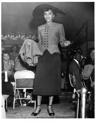 Model posing in outfit at the 20th Century Fashion Show