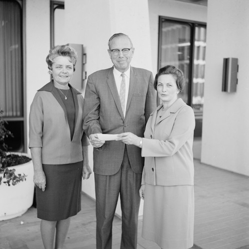 Presentation of Paul West Check to University Librarian Melvin Voigt, November 27, 1967