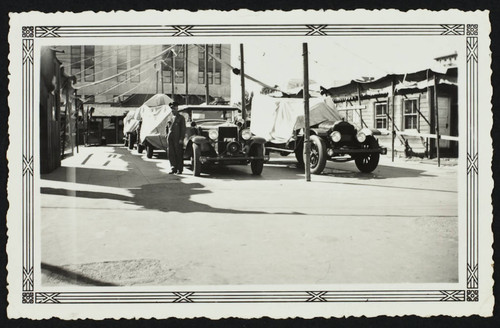 Duke Mansfield and cars in front of temporary Station No. 1, 3rd St. and Pacific Ave