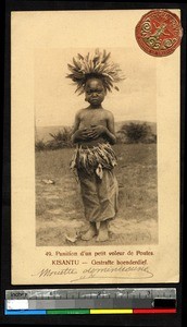 Child with chicken feathers, Kisantu, Congo, ca.1920-1940