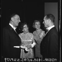 Norton and Lucille Simon talking to unidentified couple at party for Los Angeles County Museum of Art, 1965