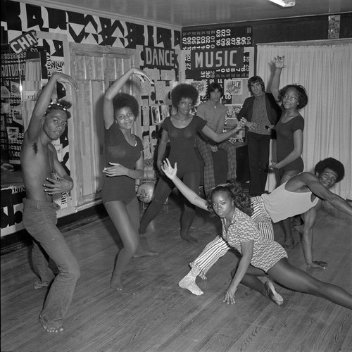 Dancers in dance stances posing for picture