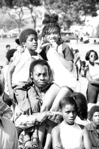 Watts Summer Festival: man with children