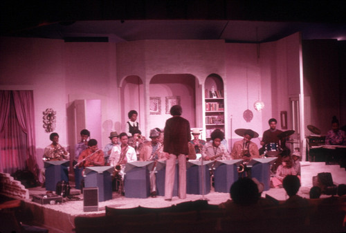 CAA academy orchestra on a stage set