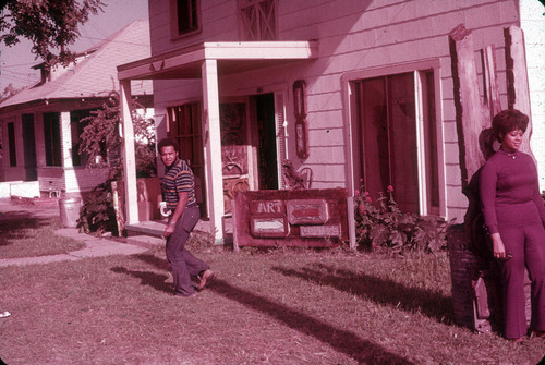 Man and woman in front of Happening House