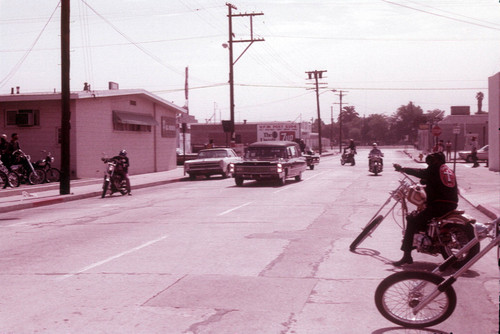 Hearse leading motorcycle funeral procession