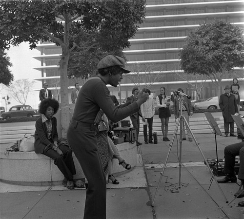 Musical performance with Troy Robinson conducting, outside