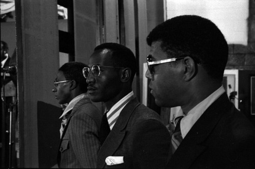 Three black Muslim men in suits