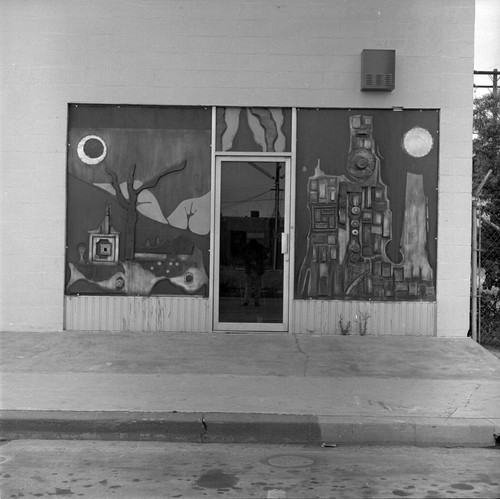 Right storefront door and windows of the Arena