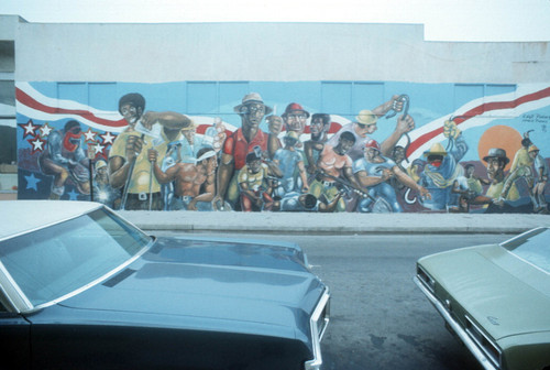 Large outdoor mural depicting working men