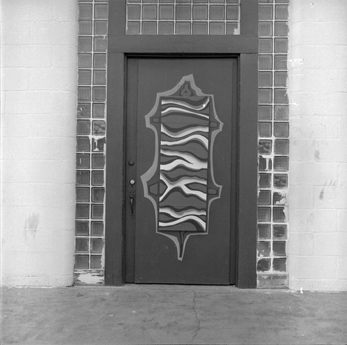 Center left door to the Arena decorated with sculpted art