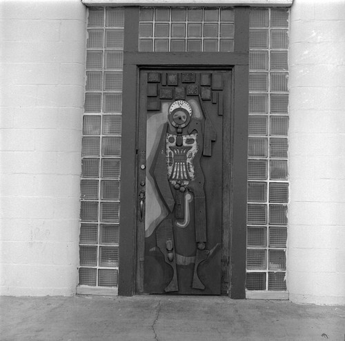 Center right door to the Arena decorated with sculpted art