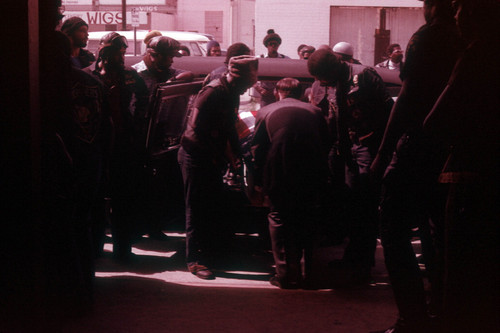 Unloading a casket from a hearse