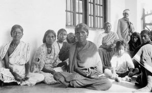 Tirukoilur, Arcot, South India. The hospital Evangelist, Mrs Connell with patients at the veran