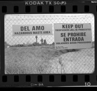 Warning signs on fence at Del Amo hazardous waste site, Torrance (vicinity), 1986