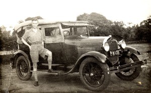 Male missionary with motor car, Nigeria, ca. 1933