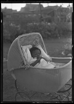 Baby in wicker carriage