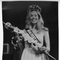 Vivian Kroner crowned queen of the Sacramento Wine Festival, shown with flowers