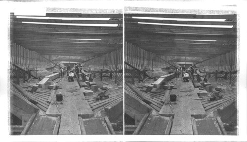 Inside the hull of a wooden vessel during construction, shipyards, Portland, Oregon