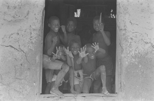 Boys waving from a window, San Basilio de Palenque, ca. 1978