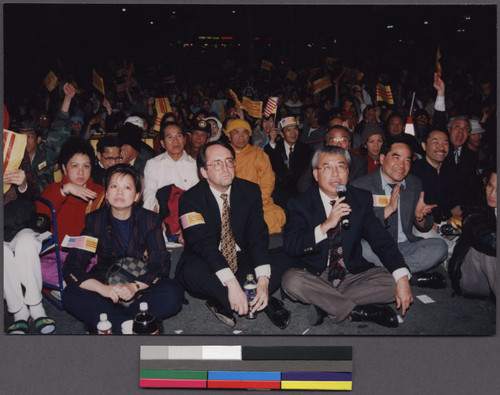 Hi-Tek protestors sitting with California State Senator Joe Dunn at a night rally