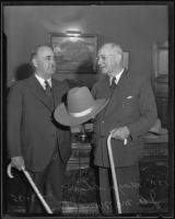 John A. McNaughton showing Mayor Shaw a ten-gallon hat, Los Angeles, 1935