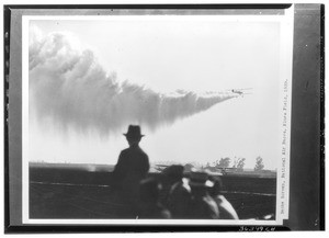 Plane leaving a smoke screen at the National Air Races at Mines Field, 1929