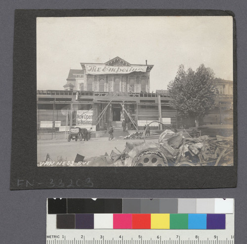 Van Ness Ave. [Former residence serves as temporary location of Emporium department store.] [Verso of FN-21208.]