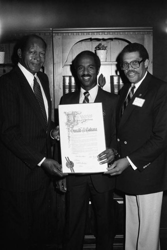 Don Bohana receiving an award from Tom Bradley and David Cunningham, Jr., Los Angeles, 1983