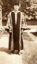 Front view of de Forest in robe and hood, honorary degree, Yale