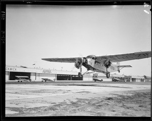 New exterior hangar, plane taking off, cockpit of plane, Southern California, 1929