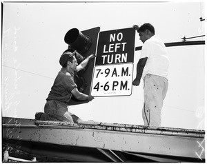 New traffic signs at Washington and Broadway being installed, 1958