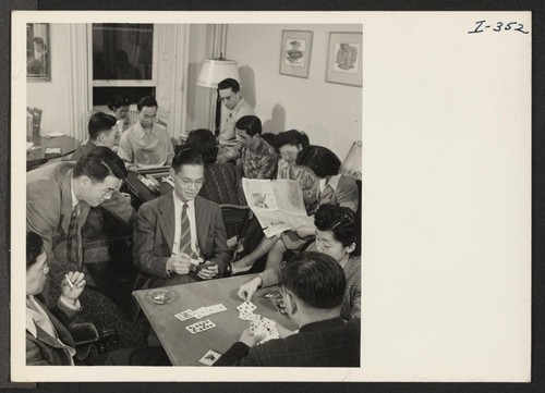 At the relocation hostel in Philadelphia, Pennsylvania, the local Nisei Steering Committee is holding its weekly social for players of