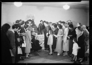 Crowd looking at prizes, Southern California, 1934