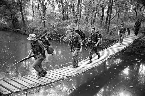 Survival school students cross a bridge, Liberal, 1982