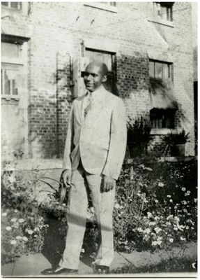 William Watts standing outside of Sheppard-Watts hospital, Marshall, Texas