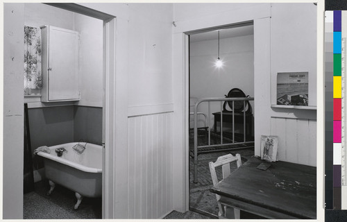 [Interior showing room with table, bathroom and bedroom. Stanislaus, California.]
