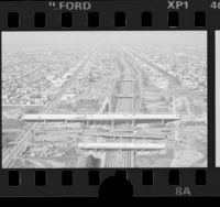 Birds-eye view of construction on Century Freeway overpass on Harbor Freeway, Los Angeles, 1986