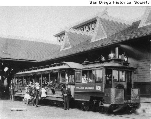 People aboard the Pacific Coast Steamship Company's train at the company's station