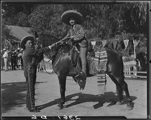 Lawrence Hill, on horseback, and Eugene Plummer at Eugene Plummer residence, Hollywood, 1931