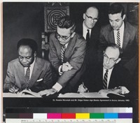 "Dr. Kwame Nkrumah and Mr. Edgar Kaiser sign Master Agreement in Accra, January, 1962," detail of page 14 in Volta River Project booklet