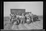 Group standing in field with "Vote for Wallace" sign, California Labor School